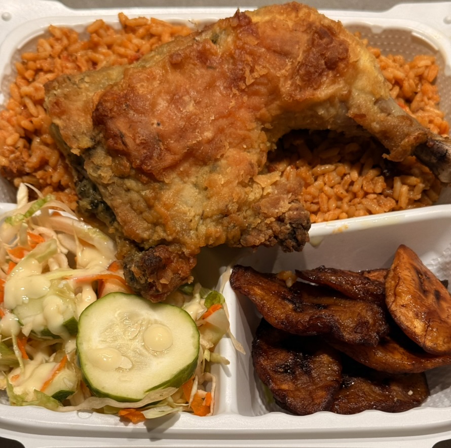 Classic Jollof Rice with fried chicken, plantains and coleslaw